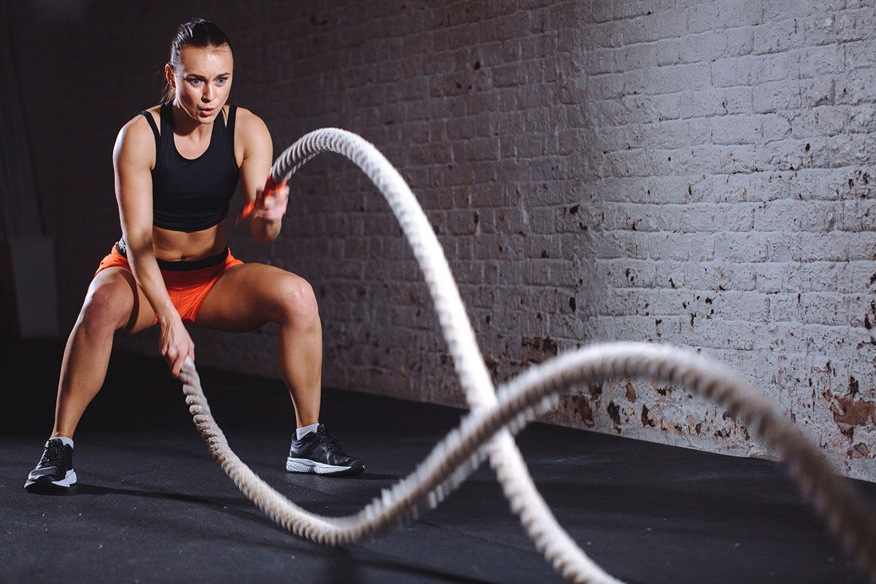 Woman on battle ropes